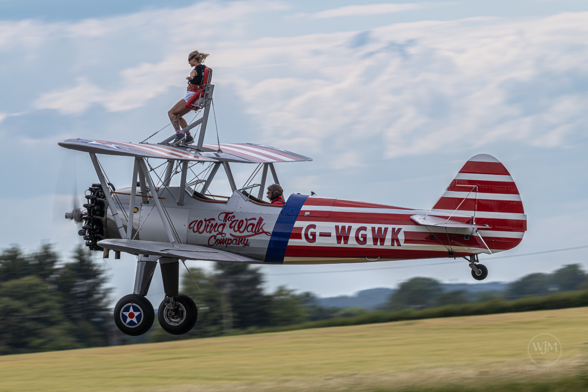Boeing Stearman side view with wing walker
