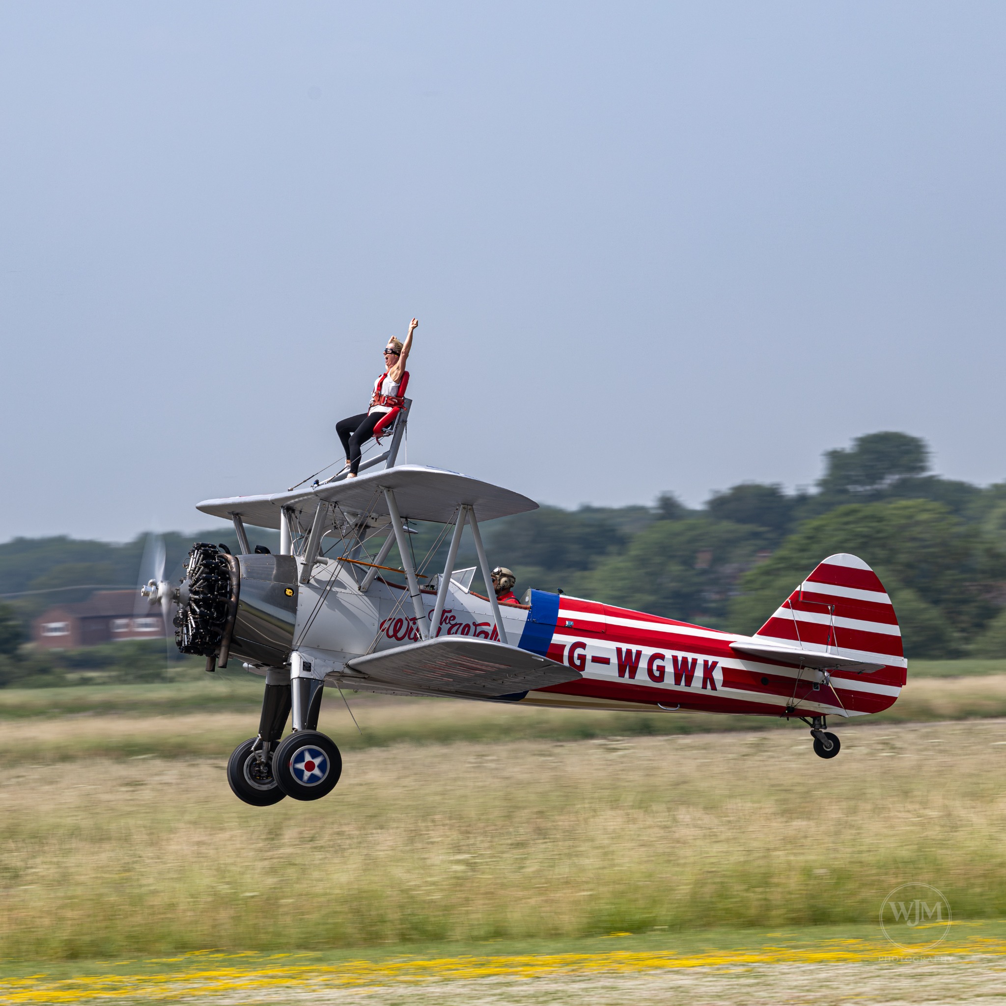 Boeing Stearman low pass with wing walker waving