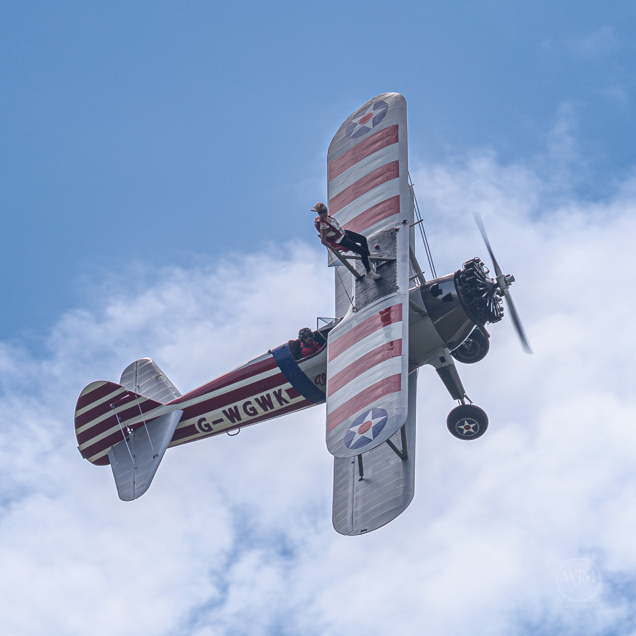 Boeing Stearman overhead with wing walker
